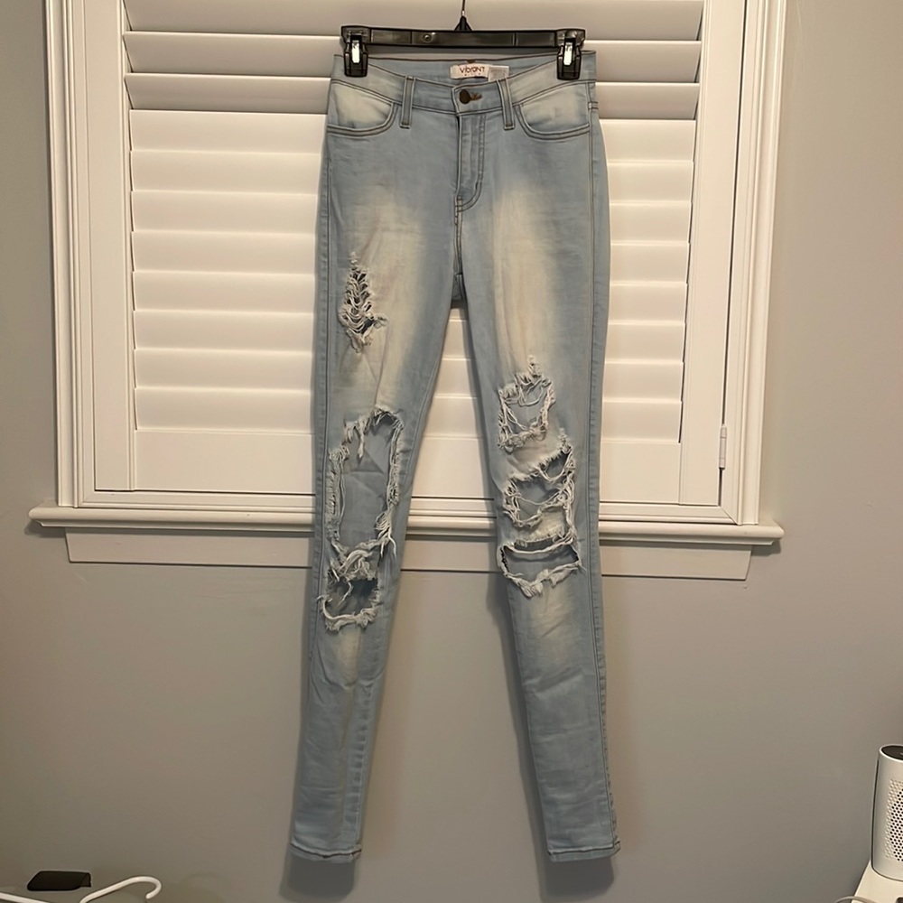 Vibrant skinny jeans with large rips. Very comfortable and looks great on!